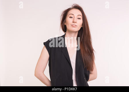 Fashionable young asian woman posing on white background Stock Photo