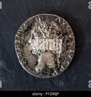 Roman Silver Denarius Coin of Emperor Hadrian - Obverse Side Showing Head with Laurel Leaf Crown Stock Photo
