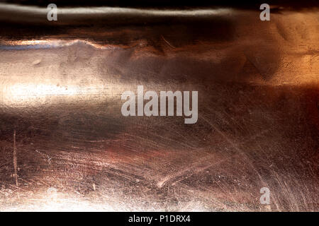 Scratched texture copper plating background close-up Stock Photo