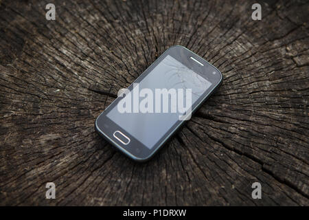 Broken mobile phone. Mobile phone with broken screen. Stock Photo
