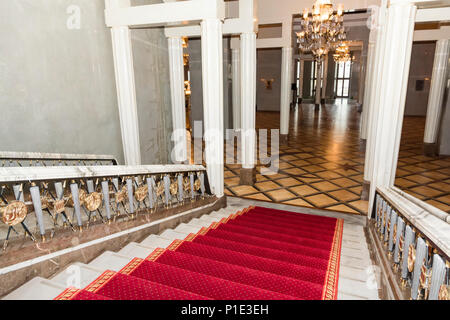 Stairwell in the Polish palace. Royal castle in Warsaw.Red carpet.