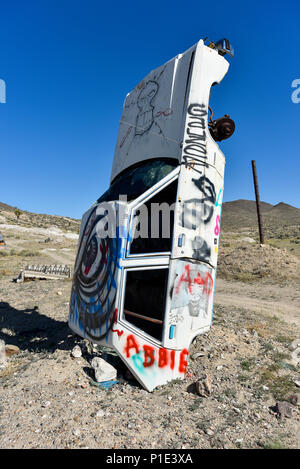 Buried art car in Goldfield Nevada Stock Photo
