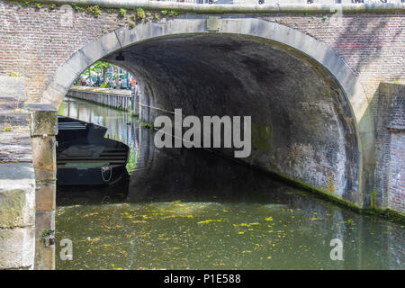 Bridge tunnel with boats and reflections in the village of Edam. netherlands Stock Photo