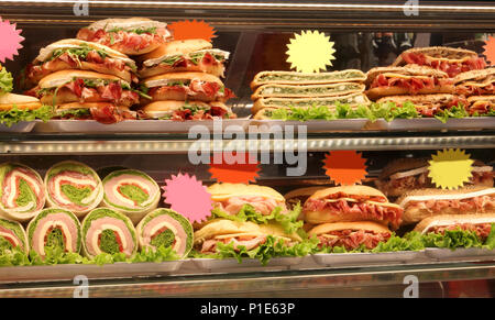 sandwiches and piadinas stuffed with meat and vegetables in a sandwich shop Stock Photo
