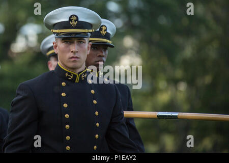 U.S. Marines in formal dress blues assemble on parade at Camp Lejeune,  North Carolina, for the Marine Corps Combat Service Support Schools Marine  Corps Birthday Ball ceremony marking the 241st anniversary of