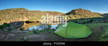 Tent at a pond near the reservoir Presa de Chira, Gran Canaria, Canary Islands, Spain Stock Photo