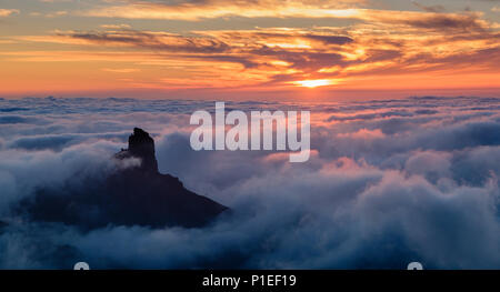 Roque Bentayga above the clouds at sunset, Gran Canaria, Canary Islands, Spain Stock Photo