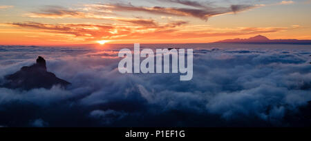 Roque Bentayga and Teide above the clouds at sunset, Gran Canaria, Canary Islands, Spain Stock Photo