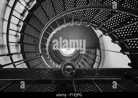 Looking down a metal spiral staircase from the top. Stock Photo