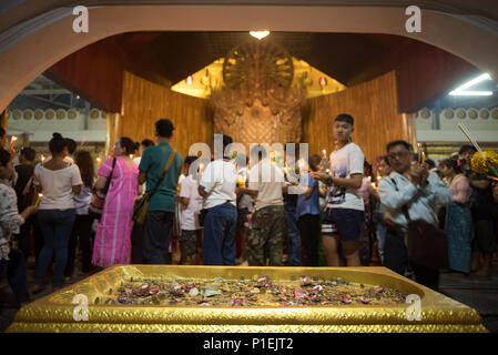 Kanchanaburi, THAILAND - JULY 8: Thai Buddhist monk hands holding candle cup at Sangklaburi temple on July 8, 2017 in Kanchanaburi, Thailand. Stock Photo