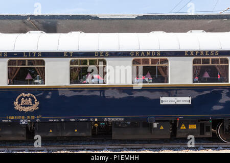 Venice Simplon Orient Express luxury train in Venice St Lucia Station,  Venice, Veneto, Italy, Sleeping car with emblem, insignia on carriage, wagon Stock Photo