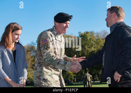 First Army’s Command Sgt. Maj. Sam K. Young and his family shake hands with guests at the conclusion of Young’s Change of Responsibility Ceremony at Rock Island Arsenal, Ill., Oct. 21, 2016. The ceremony commemorated Command Sgt. Maj. Richard K. Johnson relieving Young as command sergeant major of First Army. Young was scheduled to retire the following February after more than 30 years of honorable service. (Photo by Staff Sgt. Ian M. Kummer, First Army Public Affairs) Stock Photo