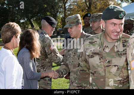 First Army’s Command Sgt. Maj. Sam K. Young and his family shake hands with guests at the conclusion of Young’s Change of Responsibility Ceremony at Rock Island Arsenal, Ill., Oct. 21, 2016. The ceremony commemorated Command Sgt. Maj. Richard K. Johnson relieving Young as command sergeant major of First Army. Young was scheduled to retire the following February after more than 30 years of honorable service. (Photo by Staff Sgt. Ian M. Kummer, First Army Public Affairs) Stock Photo