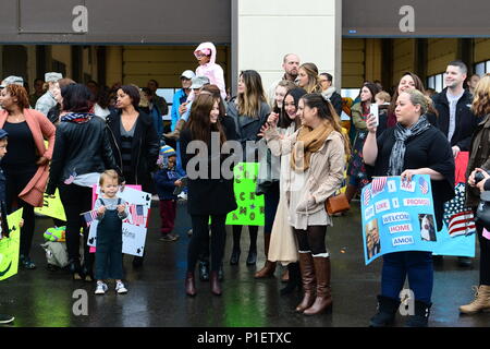 Military families and friends wait for the 606th Air Control Squadron to return to Spangdahlem Air Base, Germany, Oct. 20, 2016. Nearly 200 Airmen assigned to the 606th ACS returned, from a six-month rotational deployment to Southwest Asia in support of Operations Freedom’s Sentinel and Inherent Resolve. (U.S. Air Force photo by Senior Airman Joshua R. M. Dewberry) Stock Photo