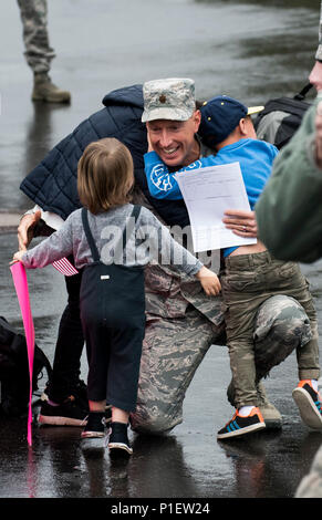 An Airman assigned to the 606th Air Control Squadron greets his children during the squadron’s return to Spangdahlem Air Base, Germany, Oct. 20, 2016. The squadron’s homecoming takes place in advance of their upcoming relocation from Spangdahlem to Aviano Air Base, Italy, in 2017 as part of the European Infrastructure Consolidation plan. (U.S. Air Force photo by Airman 1st Class Preston Cherry) Stock Photo