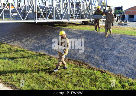 U.S. Army paratroopers assigned to the 173rd Airborne Brigade, 54th Brigade Engineer Battalion and Italian army soldiers from the 2nd Engineer Regiment Pointieri Piacenza work together to assemble the component items of a bridge during Exercise Livorno Shock at Leghorn Army  DEPOT, Italy, Oct. 22, 2016. Livorno Shock is a combined readiness exercise designed to familiarize U.S. paratroopers with river crossing capabilities and is led by the Italian Army’s 2nd Engineer Regiment Pointieri. The 173rd Airborne Brigade is the U.S. Army's Contingency Response Force in Europe, providing rapidly-deplo Stock Photo