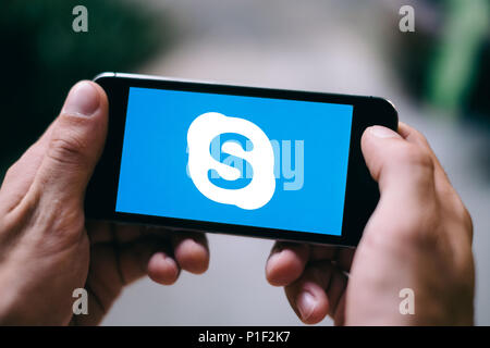Closeup of iPhone Screen with SYKPE MESSENGER LOGO or ICON on smartphone Stock Photo
