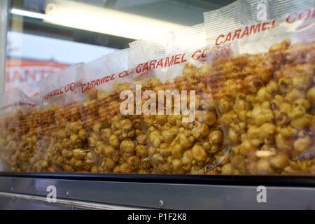 Bags of caramel corn are among the sugary treats found at a local carnival's concession stand. Stock Photo