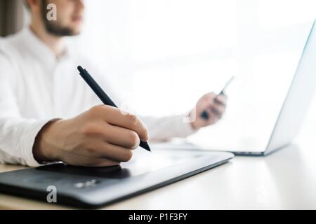 Side view shot of business man using smart phone in interior at  Stock Photo