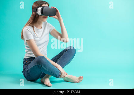 close up side view portrait of young woman in VR glasses Stock Photo