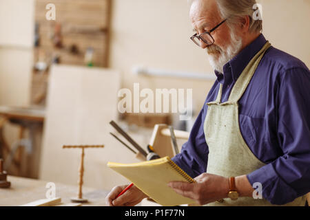 pensioner is designing new project Stock Photo