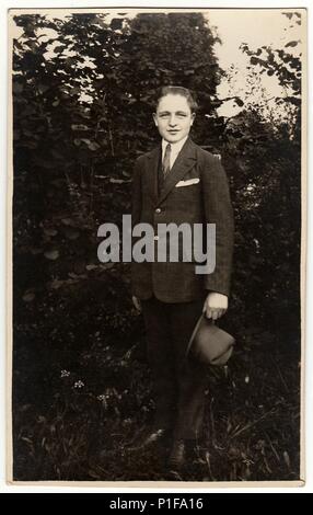 THE CZECHOSLOVAK REPUBLIC - CIRCA 1940s: Vintage photo shows man wears suit with an elegant hat poses outdoors. Black & white antique photo. Old photo, 1940s. Stock Photo