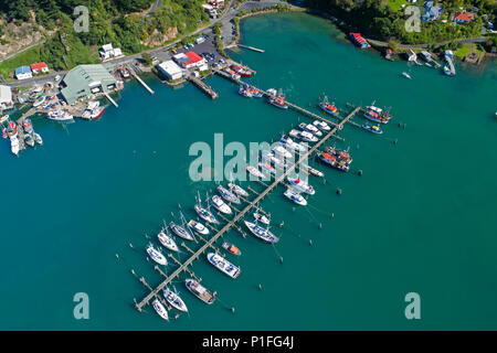 Fishing Boats at Carey's Bay Wharf and Otago Harbour, Port Chalmers, Dunedin, Otago, South Island, New Zealand - drone aerial Stock Photo