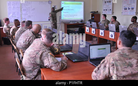 Staff Sgt. Michael Johnson, a small group leader assigned to 7th ATC, teaches Soldiers assigned to 6th Squadron, 8th Cavalry Regiment, 2nd Infantry Brigade Combat Team, 3rd Infantry Division basic leader skills during Basic Leader Course, Nov.1, at the International Peacekeeping and Security Center. A mobile training team, from the Noncommissioned Officer Academy from 7th Army Training Command, came to Ukraine to instruct the Soldiers, who are currently on a six-month deployment in support of the Joint Multinational Training Group-Ukraine. JMTG-U is training Ukrainian land forces and building  Stock Photo