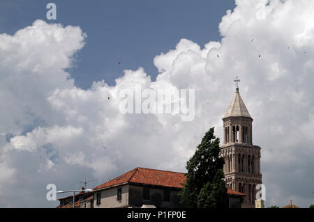 Dramatic clouds behind a church tower in Split, Croatia Stock Photo