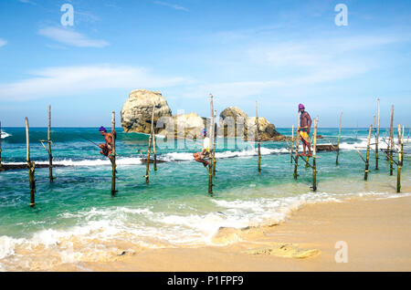 Stilt fishermen, Ahangama, Sri Lanka Stock Photo