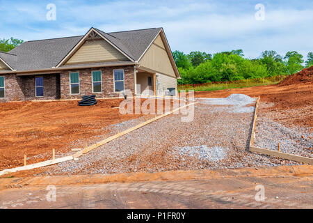 Horiozntal shot of driveway construction on new home. Stock Photo