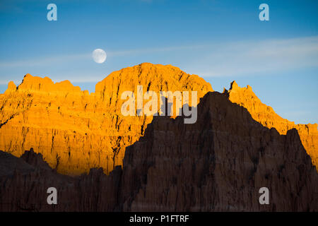 Moonrise over rock formations in Cathedral Gorge state park in South Eastern Nevada, USA. Stock Photo