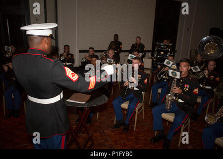 Gunnery Sgt. Justin Hauser, enlisted conductor of Marine Corps Band New Orleans, conducts the band while attending Detachment 1, Landing Support Company, Combat Logistics Regiment 45, 4th Marine Logistics Group’s 241st Marine Corps Birthday Ball celebration in Rio Grande, Puerto Rico, Oct. 22, 2016. The Reserve Marines are celebrating the 241st birthday as well as the Marine Corps Reserve Centennial anniversary. For the past week they have joined Marine Corps Band New Orleans to commemorate 100 years of rich history, heritage, espirit-de-corps, and a bond with not only Puerto Rico but with com Stock Photo
