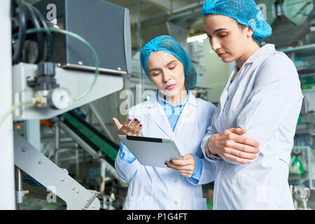 Two Female Workers at Factory Stock Photo