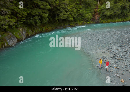 Tourists by Makarora River, Blue Pools, Mount Aspiring National Park, Haast Pass, near Makarora, Otago, South Island, New Zealand (model released) Stock Photo