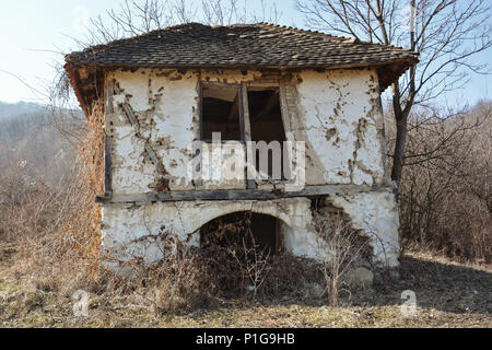 19th Century old house in the wood made of clay tiles, bricks and mud. Last owner died in 1953. In the middle of the forest, with no owner. Stock Photo
