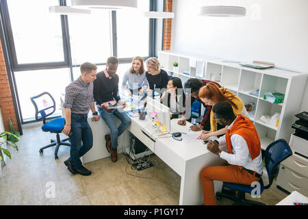 top view image of young people engaged in lively discussion. Stock Photo