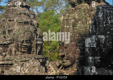 The famous 'face towers' of Bayon temple, Angkor Thom, Cambodia. Giant gothic towers with the smiling image of Avalokiteshvara or Lokesvara Stock Photo