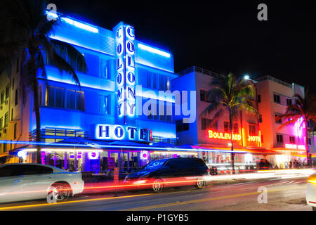 MIAMI BEACH, FLORIDA - JUNE 12, 2018: famous art deco district of Ocean Drive in South Beach by night, the Colony Hotel. Miami, USA