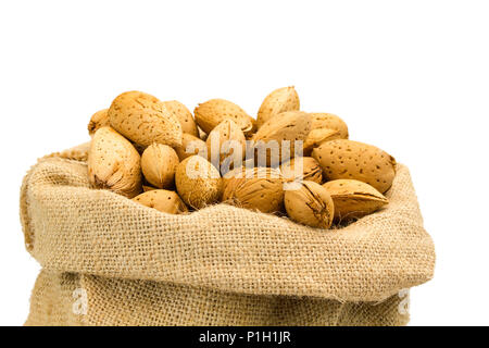 organic almonds inside a rustic bag Stock Photo