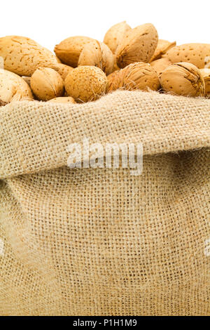 organic almonds inside a rustic bag Stock Photo