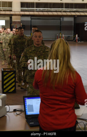 Soldiers with 215th Military Police Detachment and the 467th Engineer Detachment Firefighting Headquarters, Army Reserve units, are manifested and processed prior to deploying in support of Operation Freedom’s Sentinel from the Silas L. Copeland Arrival/Departure Airfield Control Group here Nov. 30. Stock Photo