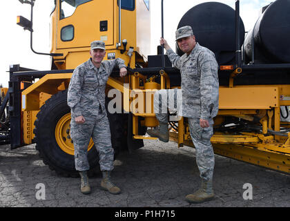 Col. Ryan Samuelson, 92nd Air Refueling Wing Commander, and Col. Matthew Fritz, 92nd ARW Vice Commander, pose next to a heavy snow plow during the annual Snow Parade Oct. 14, 2016, Fairchild Air Force Base, Wash. Base commanders are invited to take part in the parade to give confidence to the base's winter preparedness. Stock Photo