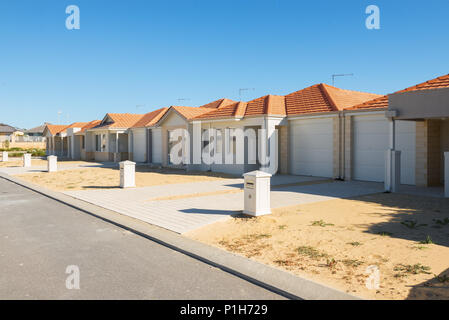 new suburban homes currently under construction in row Stock Photo