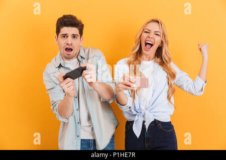 Joyful couple winning video games with joystick on console in studio.  Boyfriend and girlfriend playing online game with controller to win,  feeling happy and relaxed with leisure activity Stock Photo - Alamy