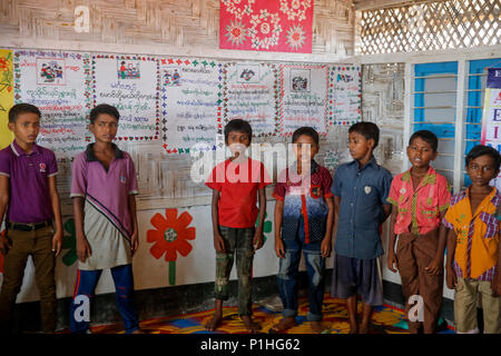 Rohingya refugee children attend class at a temporary school in ...