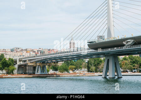 Part of the bridge in Istanbul connecting the Asian part with the European part of the city. The architecture of Istanbul is on the background Stock Photo