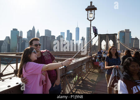 Couple taking a selfie, Brooklyn Bridge, Manhattan, New York city USA Stock Photo