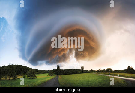 Panoramic image of the base of a LP supercell during sunset, near Herborn, Hessia, Germany Stock Photo