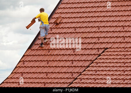 Worker on the roof Stock Photo